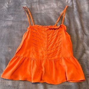 Burnt orange tank top from Tennis.
